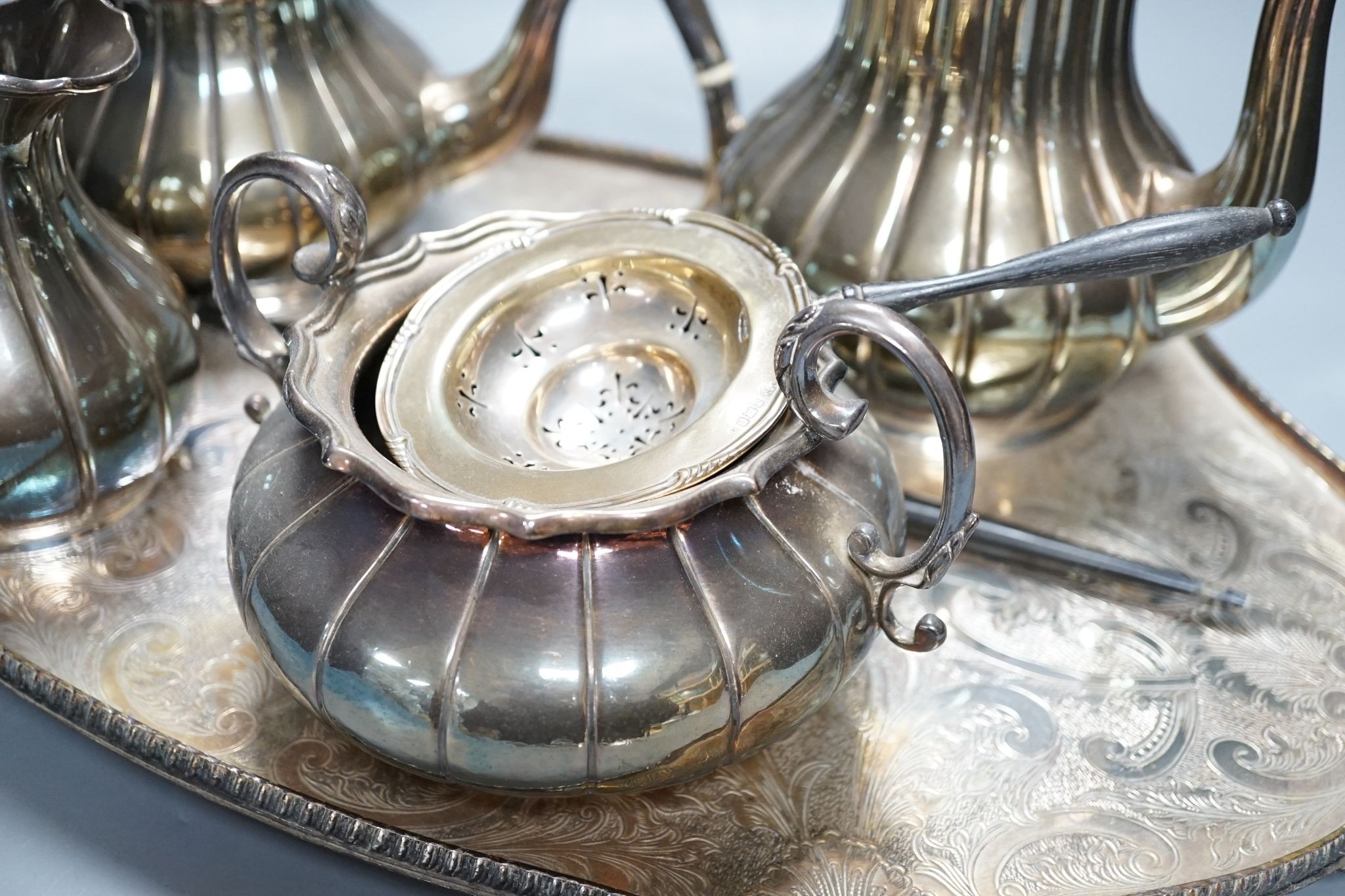 A four piece plated tea set and tray